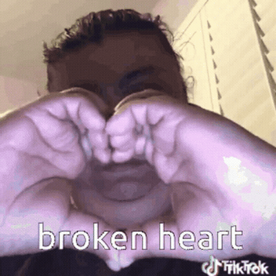 Man Making Broken Heart With Hands GIF
