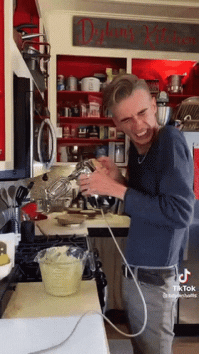 Man Making Cake In Delaney's Kitchen GIF