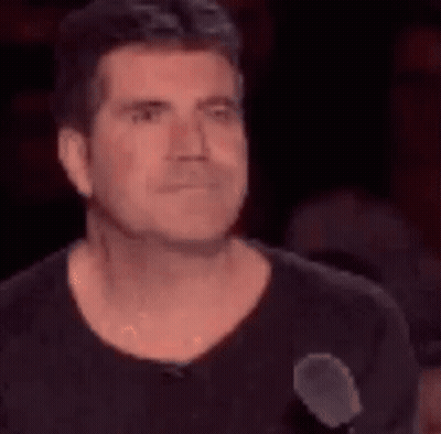Man Making Face At Microphone GIF