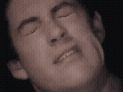 Man Making Face With Eyes Closed GIF