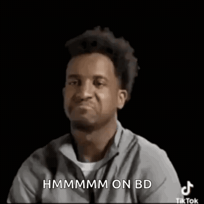 Man Making Funny Face And Pointing At Camera In Grey Shirt GIF
