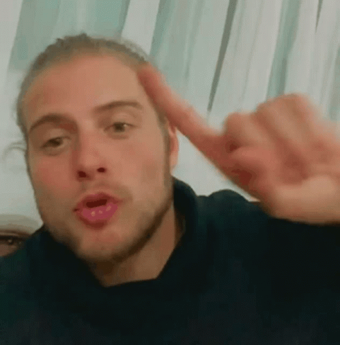 Man Making Funny Face And Pointing Finger GIF