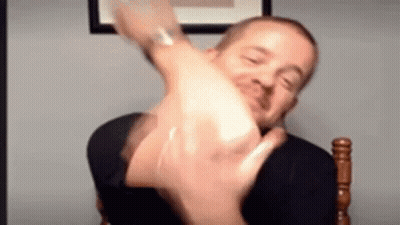 Man Making Funny Face And Raising Hand GIF