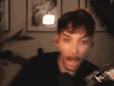 Man Making Funny Face At Microphone GIF