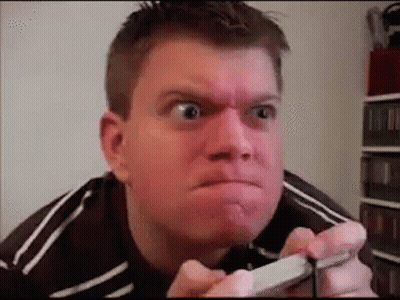 Man Making Funny Face Holding Cell Phone GIF