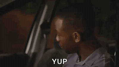 Man Making Funny Face In Car GIF