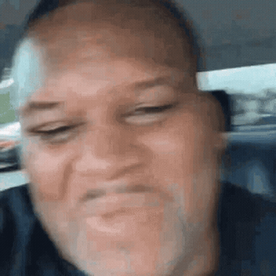 Man Making Funny Face In Car GIF