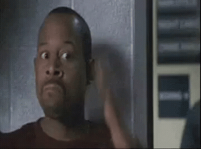 Man Making Funny Face In Dark Room GIF