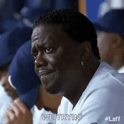 Man Making Funny Face In Dugout With Team GIF