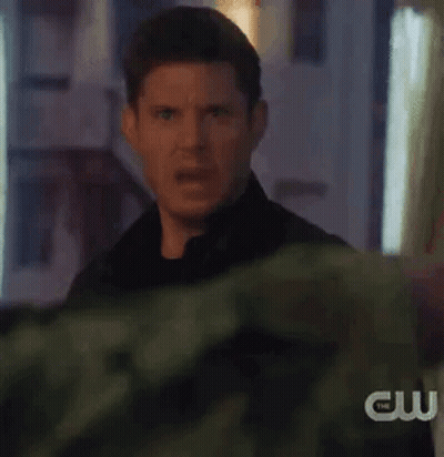 Man Making Funny Face In Front Of Building GIF