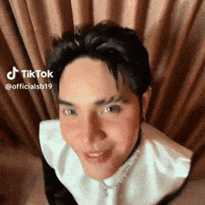 Man Making Funny Face In Front Of Curtain TikTok GIF