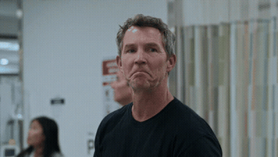 Man Making Funny Face In Front Of Emergency Room Sign GIF