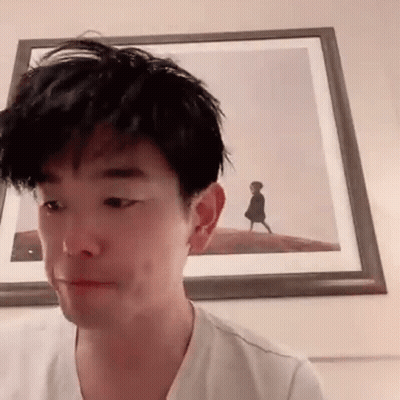 Man Making Funny Face In Front Of Framed Picture GIF