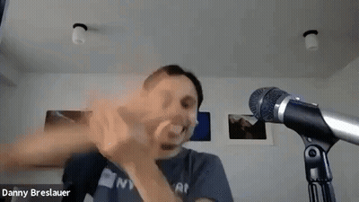 Man Making Funny Face In Front Of Microphone GIF