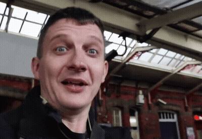 Man Making Funny Face In Front Of Red Light GIF