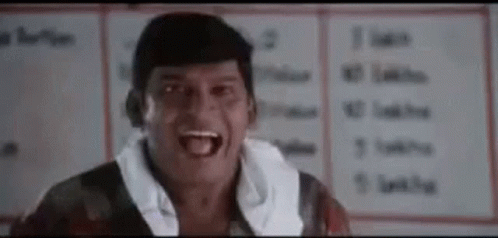 Man Making Funny Face In Front Of White Board GIF