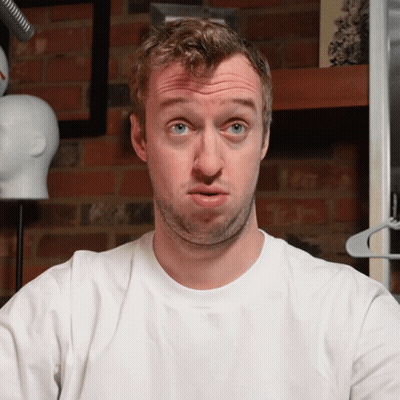 Man Making Funny Face In White Shirt GIF