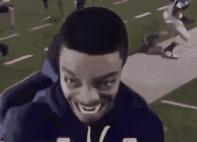 Man Making Funny Face On Chair In Football Field GIF