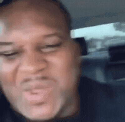 Man Making Funny Face Sitting in Car