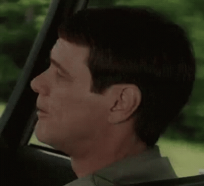 Man Making Funny Face While Driving GIF