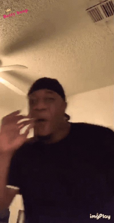 Man Making Funny Face With Ceiling Fan GIF