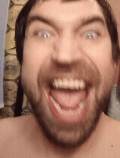 Man Making Funny Face With Teeth GIF