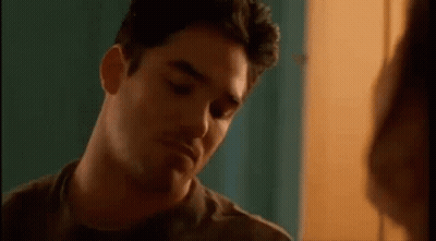 Man Making Funny Face With Woman GIF