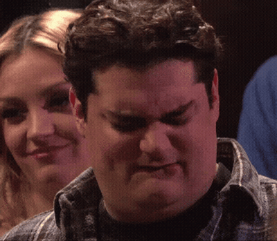 Man Making Funny Face Woman Smiling GIF