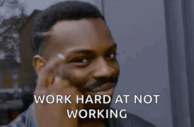 Man Making Funny Face Work Hard At Not Working GIF