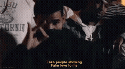Man Making Peace Sign In Front Of Crowd GIF