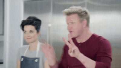 Man Making Peace Sign With Woman GIF