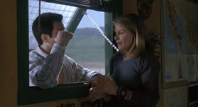 Man Measuring Woman Arm Out Window GIF