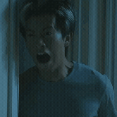 Man Mouth Open In Dark Room GIF