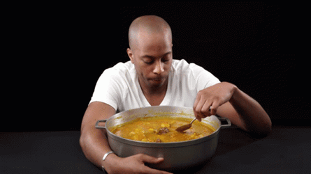 Man Munching On Pot Of Curry GIF