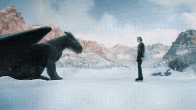 Man Next To Black Dragon In Snow GIF
