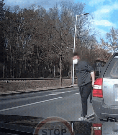 Man Next To Car With Stop Sign GIF
