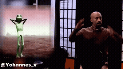 Man Next To Green Alien Dancing GIF