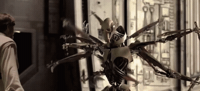 Man Next To Multi-Armed Robot GIF