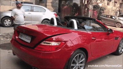 Man Next To Red Mercedes Convertible GIF