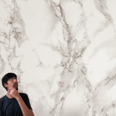 Man Next To Red Playing Card With Circular Design GIF
