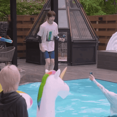 Man Next To Unicorn Inflatable GIF