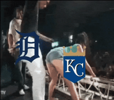 Man Next to Woman With KC Logo Shirt
