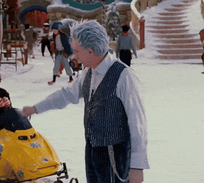 Man Next To Yellow Snowmobile With Star GIF