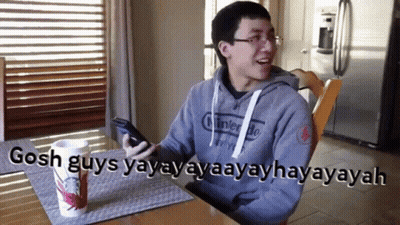 Man Nintendo Sweatshirt With Starbucks Cup At Table GIF