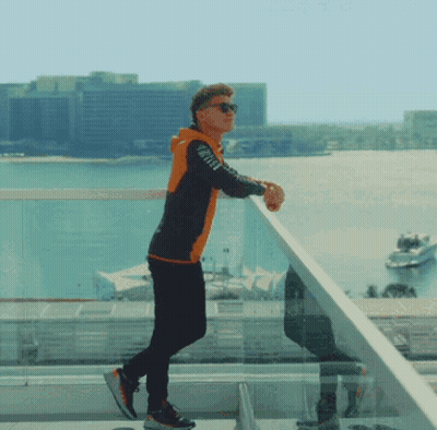 Man On Balcony Looking Over Water GIF