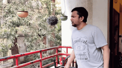 Man On Balcony Wearing Hawaii King T-Shirt GIF