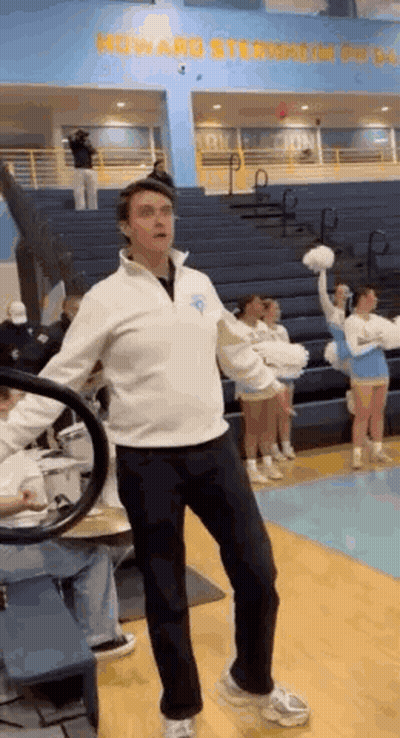 Man On Basketball Court In Front Of Cheerleader GIF