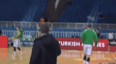 Man On Basketball Court In Front Of Turkish Airlines Banner GIF