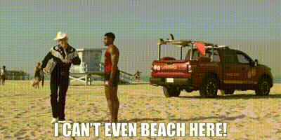 Man On Beach Next To Lifeguard And Truck GIF