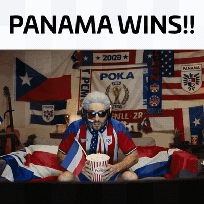 Man On Bed Holding Popcorn And Panama Wins Sign GIF
